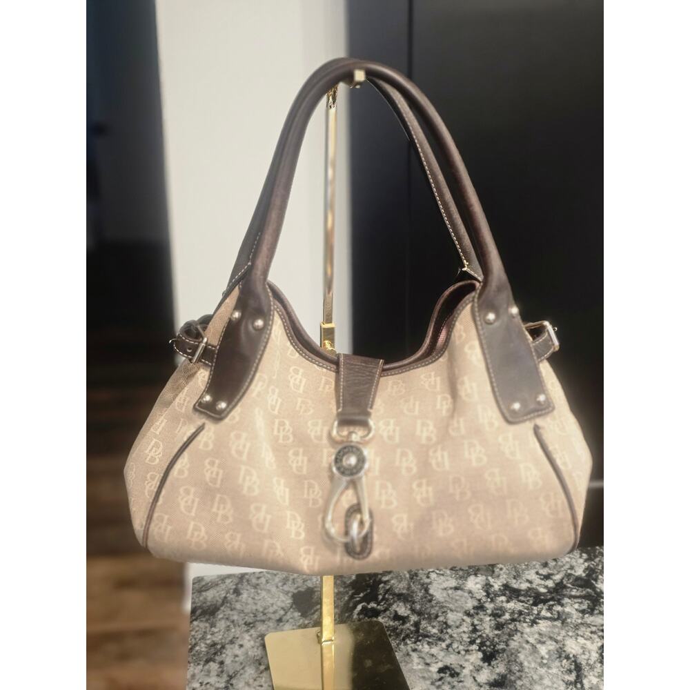 Beige and dark brown Dooney & Bourke. Really good used condition.